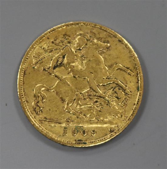 An Edward VII 1909 gold half sovereign.